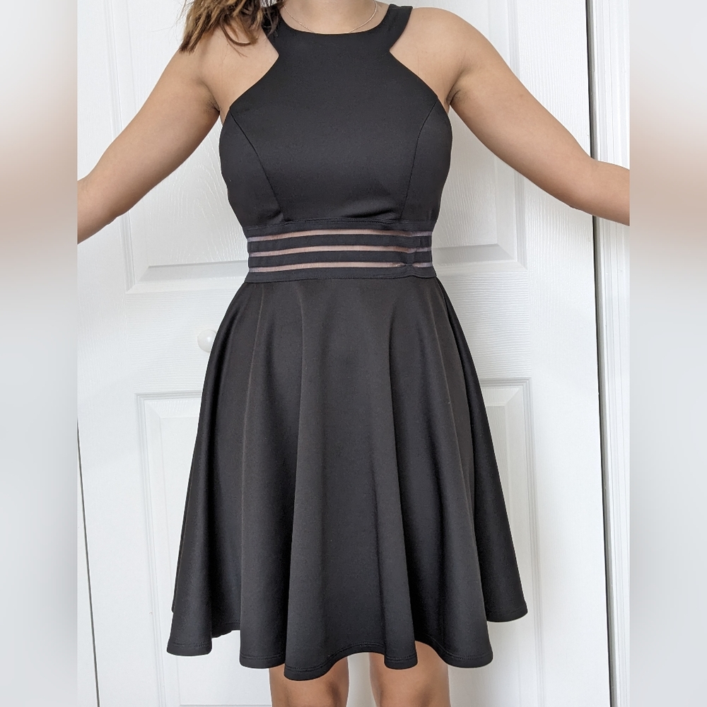 Black dress for every occasion. Fitted top, a-line skirt, halterneck front.